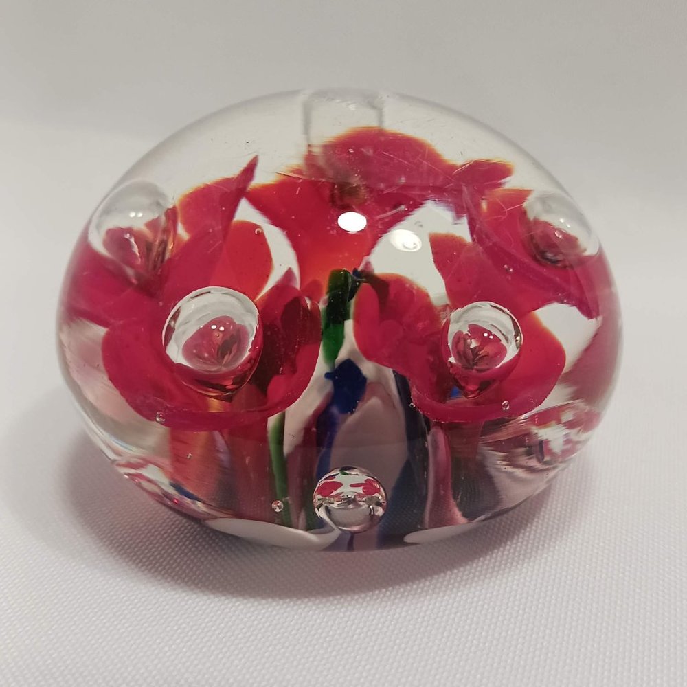 Colorful art glass Bob St Clair Paperweight with red trumpet flowers